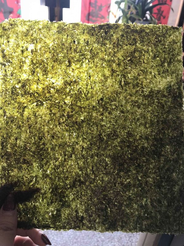 Évaluez une décoration rôtie sèche de nourriture de feuilles d'algue de sushi de Nori d'algue
